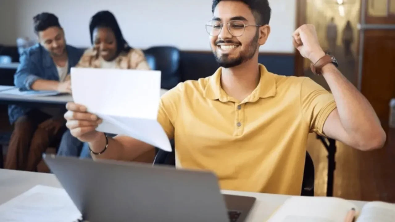 man-student-excited-letter-laptop-typing-600nw-2250273685